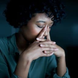 Woman with allergies and resulting symptoms.