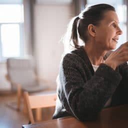 Older woman enjoying coffee in the morning.