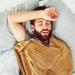 Young man snoring in his sleep.