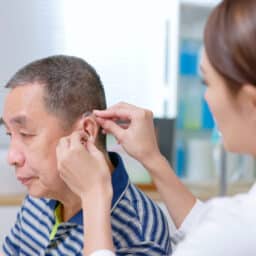 Man is fitted with hearing aids