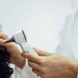 ENT conducting an ear exam