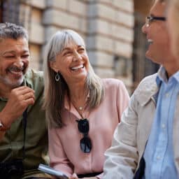 Happy group of friends laughing and chatting