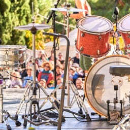 Drums on the stage while audience is waiting for the band to play at a summer music festival