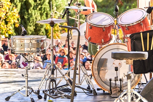 Drums on the stage while audience is waiting for the band to play at a summer music festival