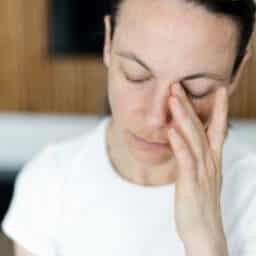Woman suffering from brain fog or allergies